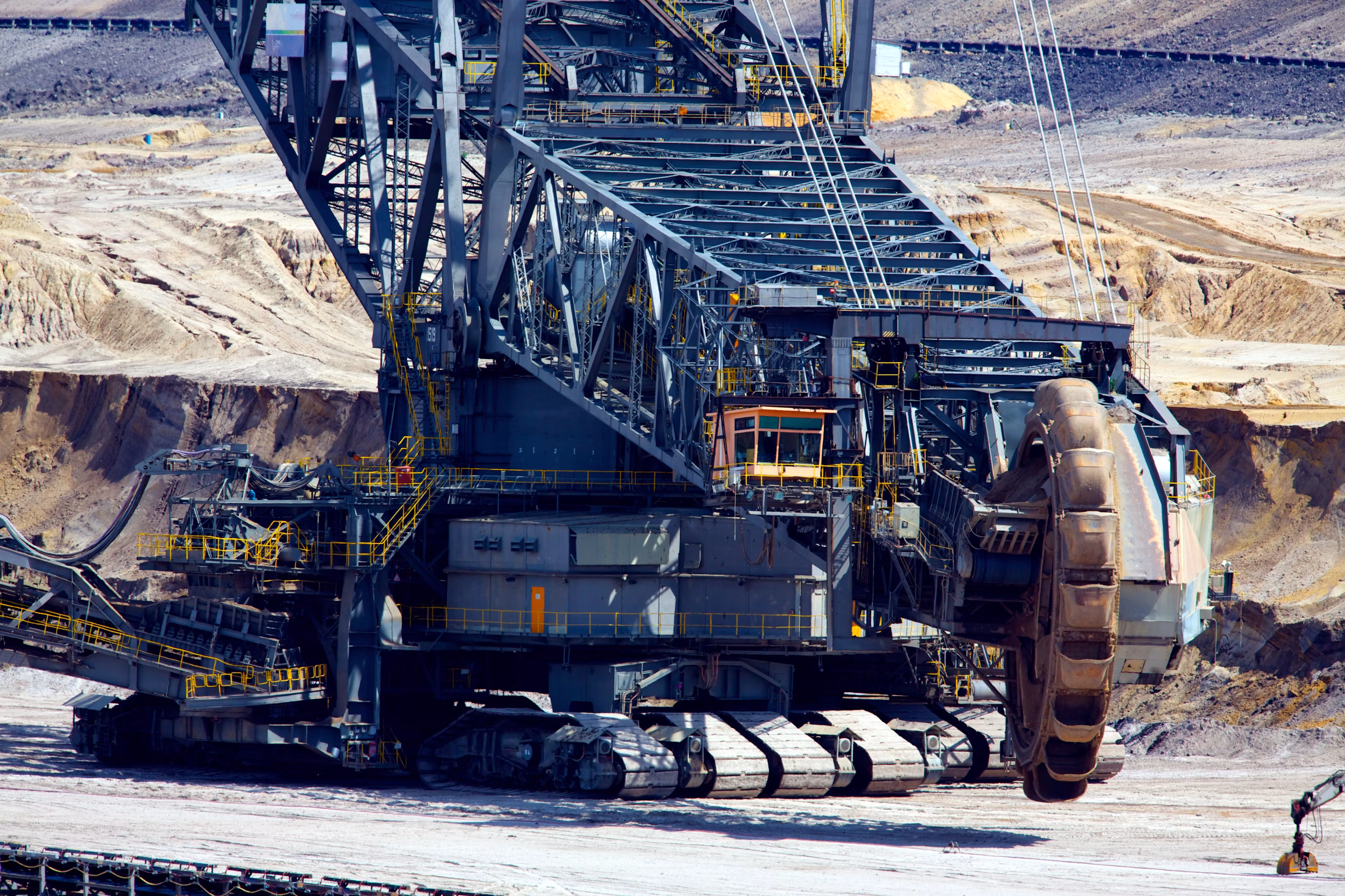 Giant bucket wheel excavator operating in heavy surface coal mining concession